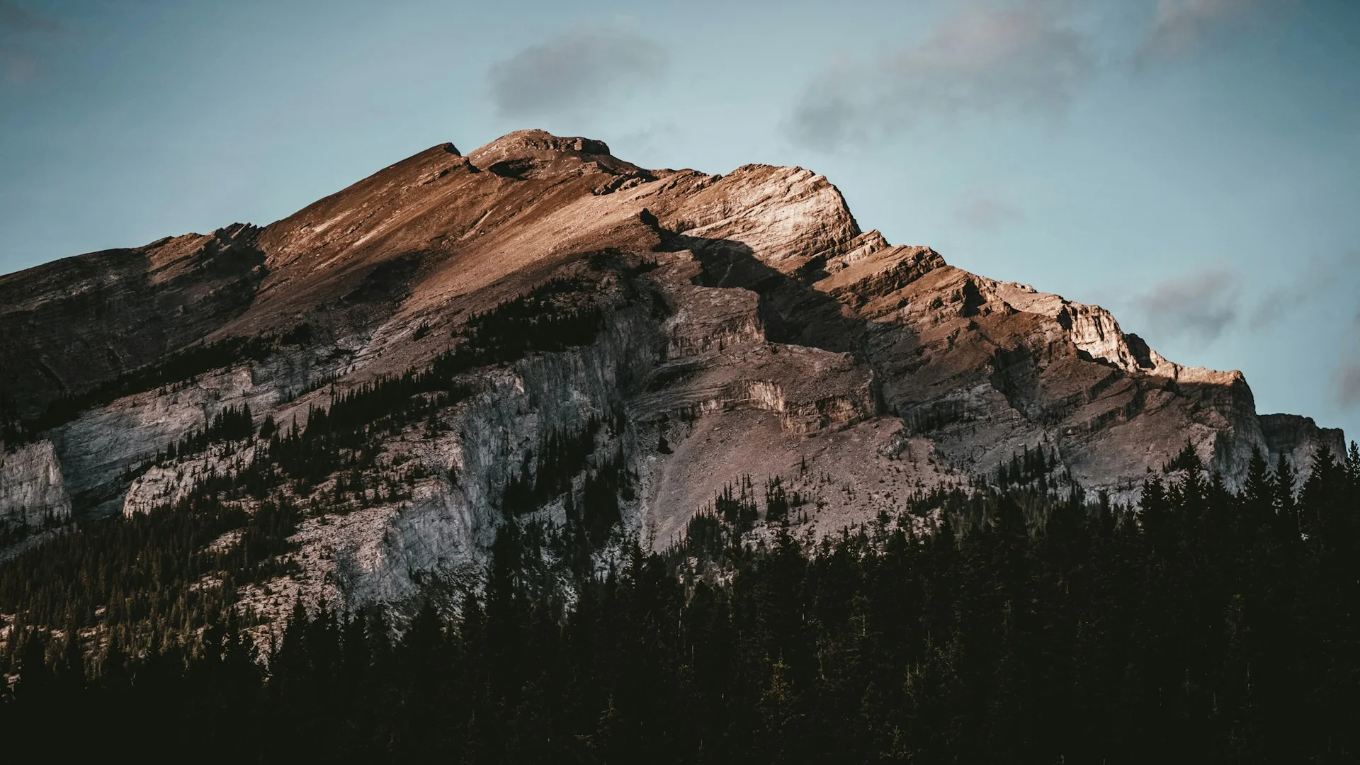 Battalion Park hillside with the Rockies visible at dusk, Signal Hill Calgary