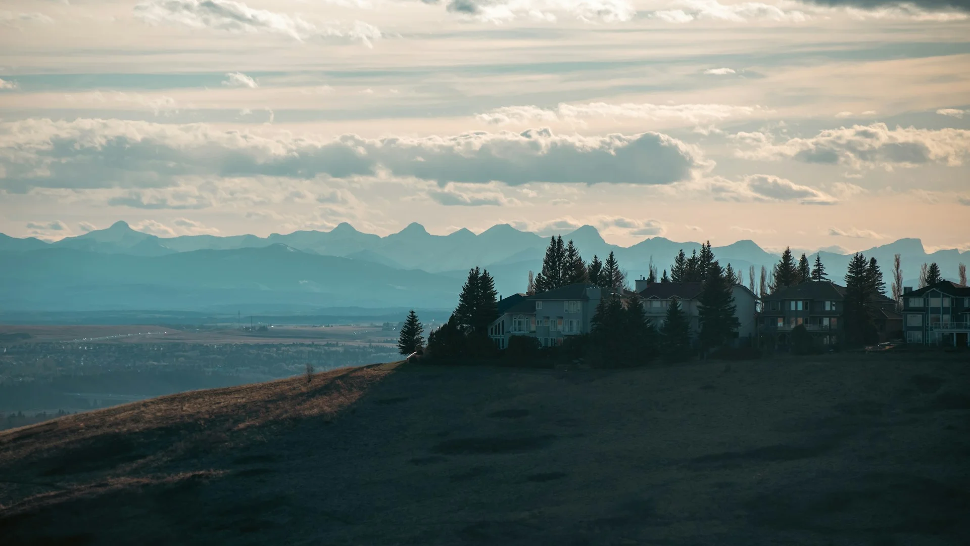 Signal Hill ridge at dusk with Rockies visible in the background