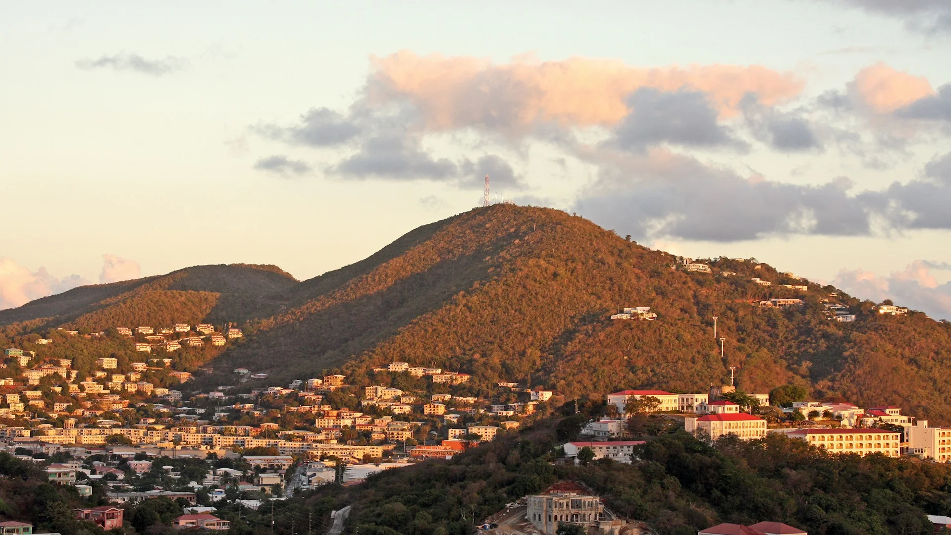 Signal Hill ridge at dusk with Rocky Mountains visible in the background