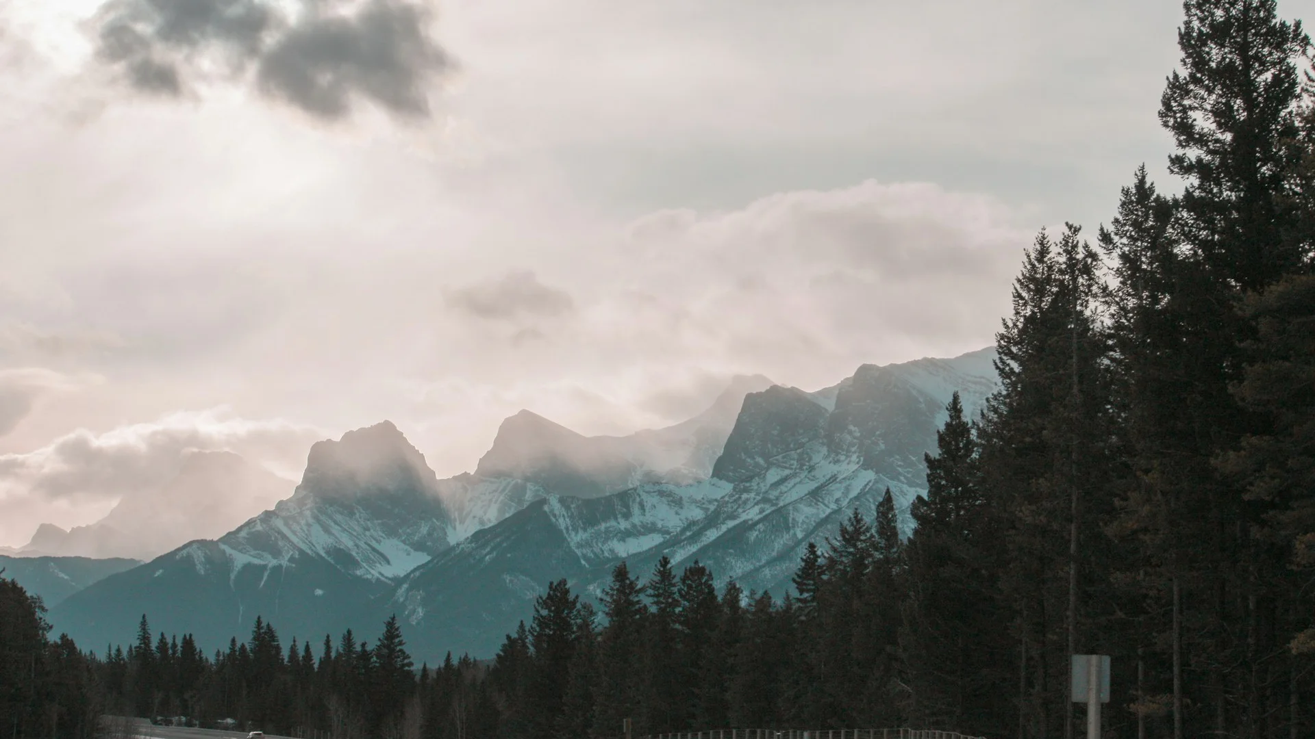 Signal Hill ridge at dusk with the Rocky Mountains visible in the background