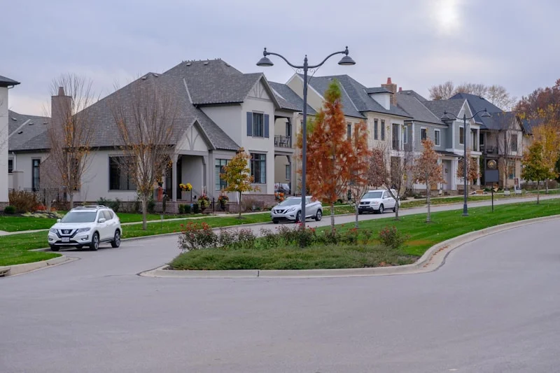 Established Signal Hill residential street showing mature trees, large lots, and detached homes with attached double garages