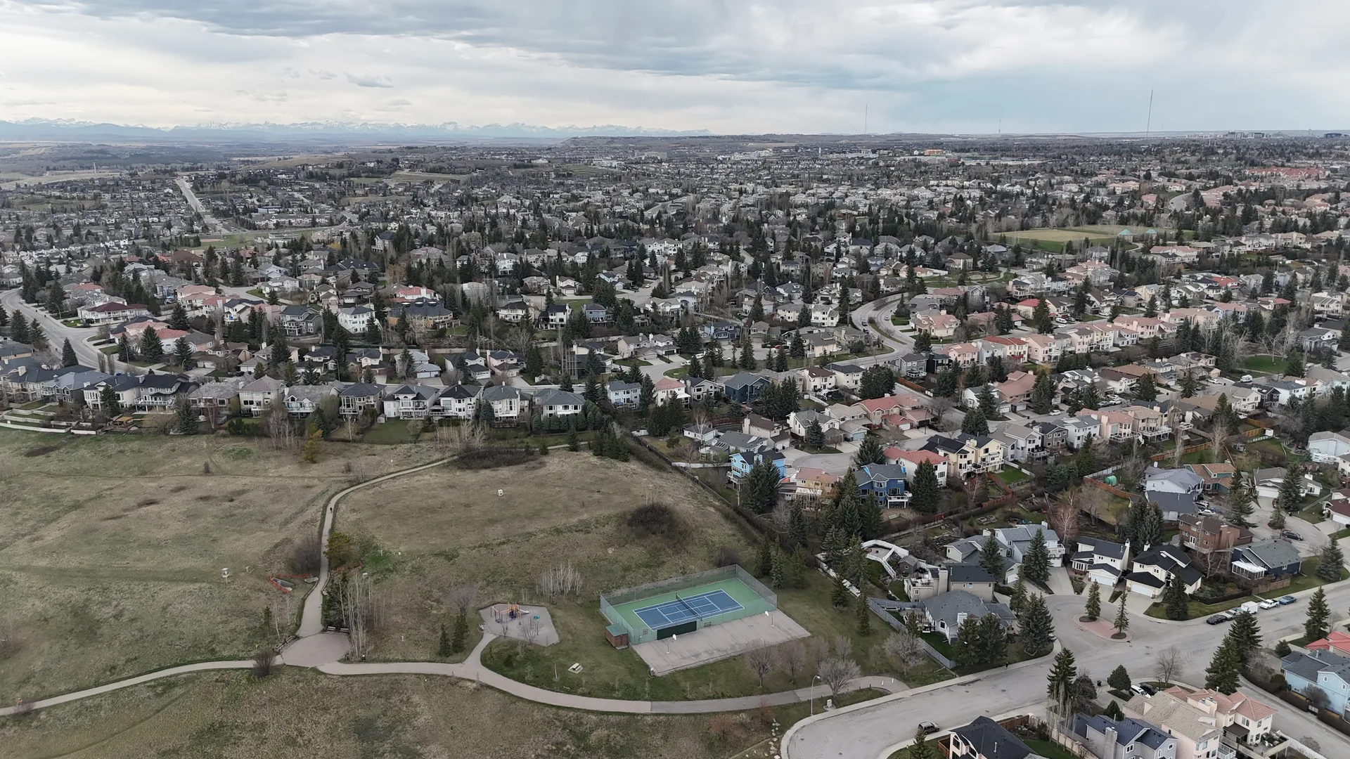 Aerial drone view of Signal Hill residential streets in southwest Calgary